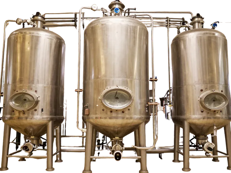 Three stainless steel fermentation vessels seen from the front
